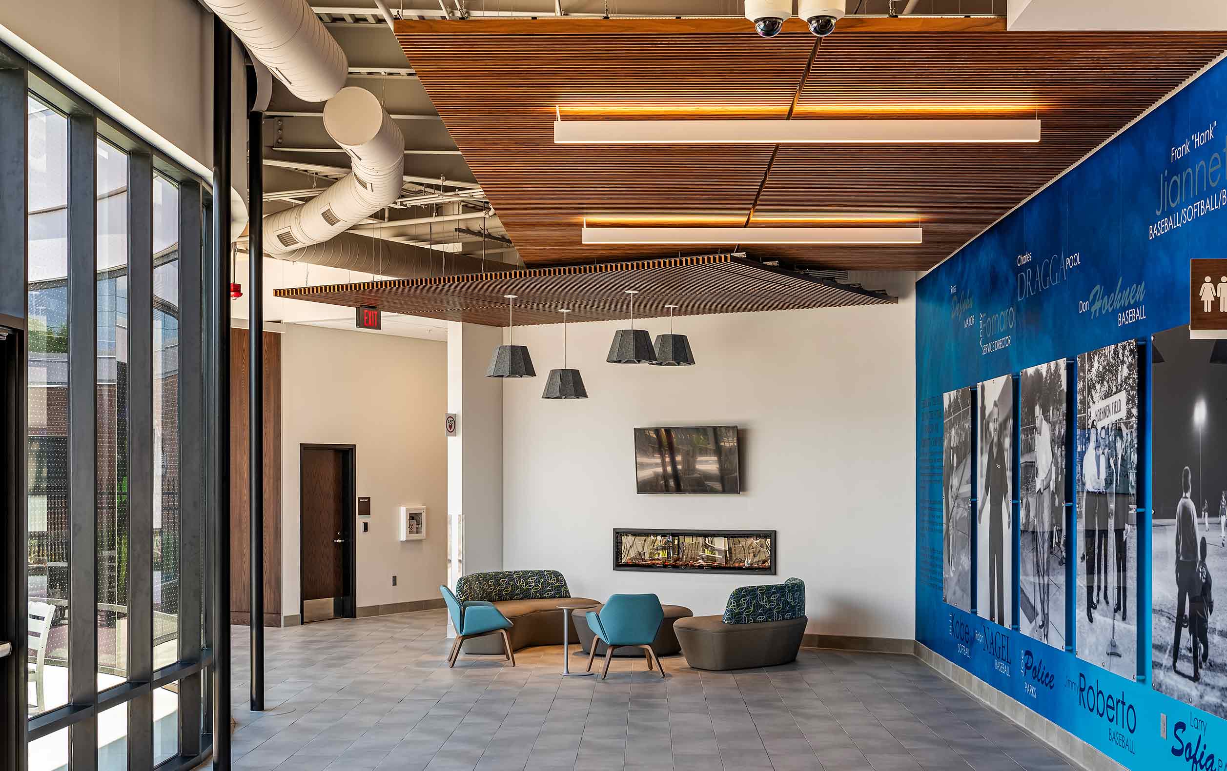 Aquatic community center seating area with feature wall and windows