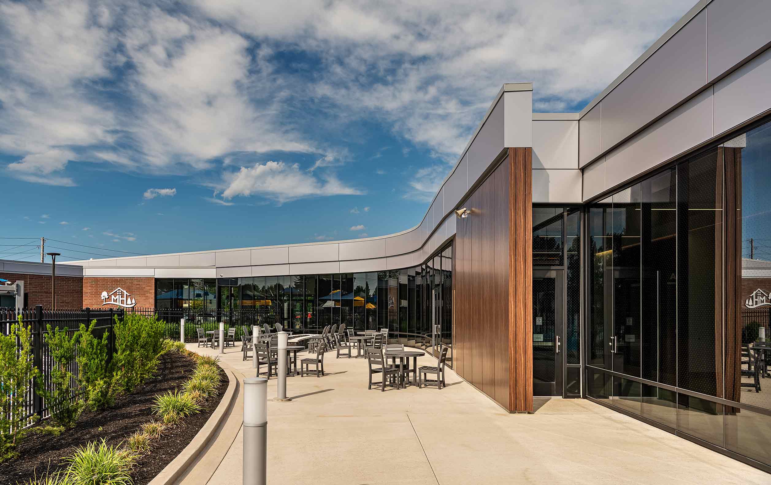 Aquatic center porch embraced by curving building