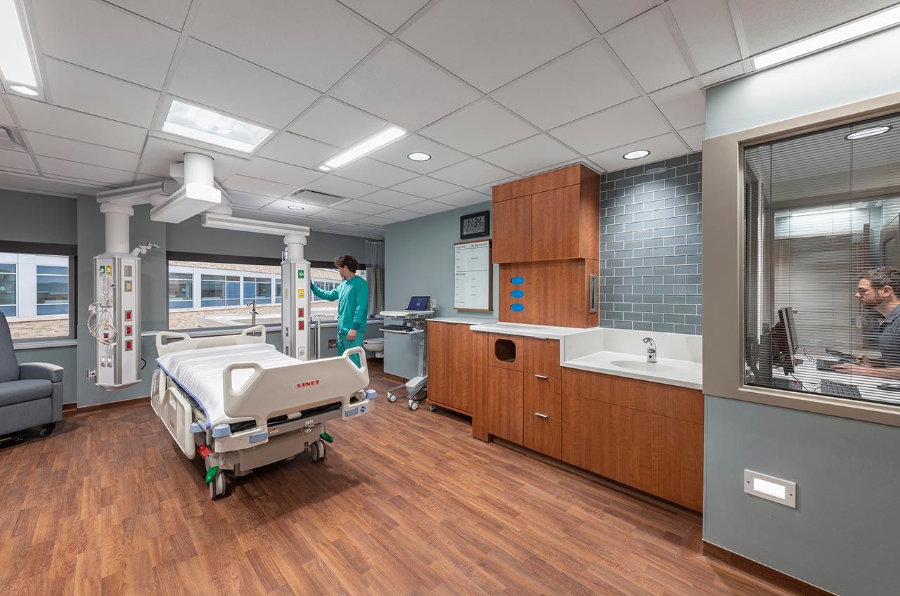 ICU room with caregiver and observation room