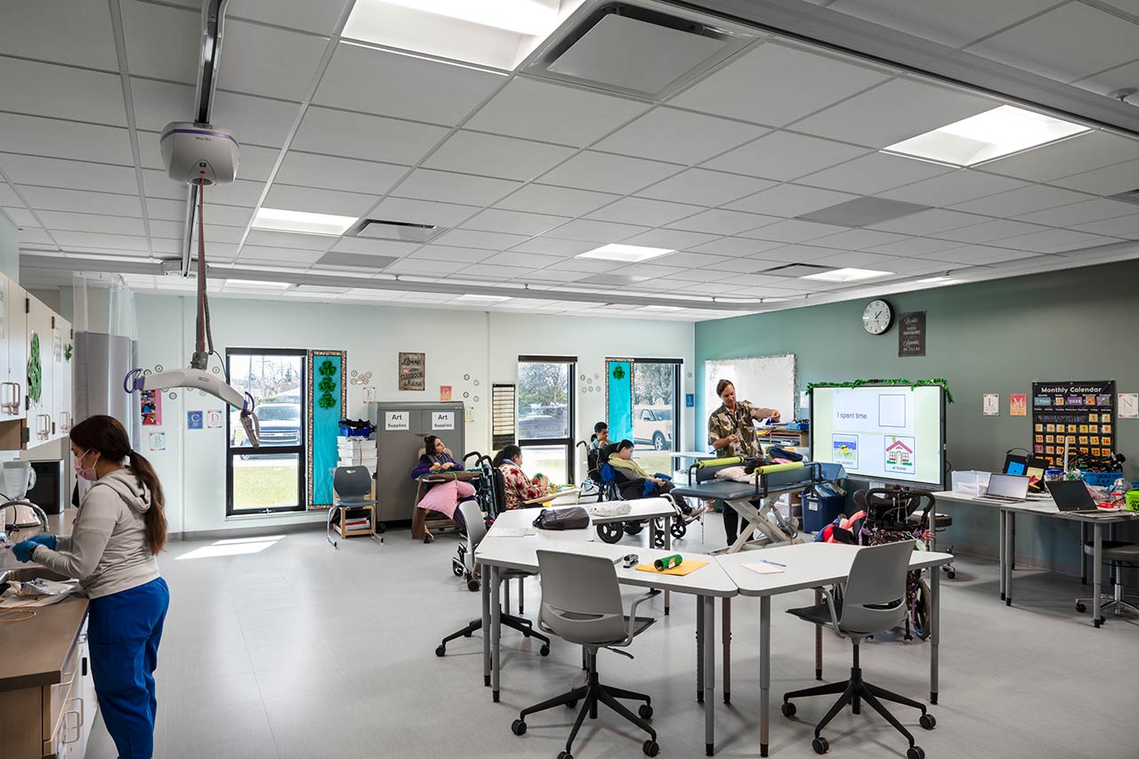 Classroom with neurodiverse students and specialized equipment