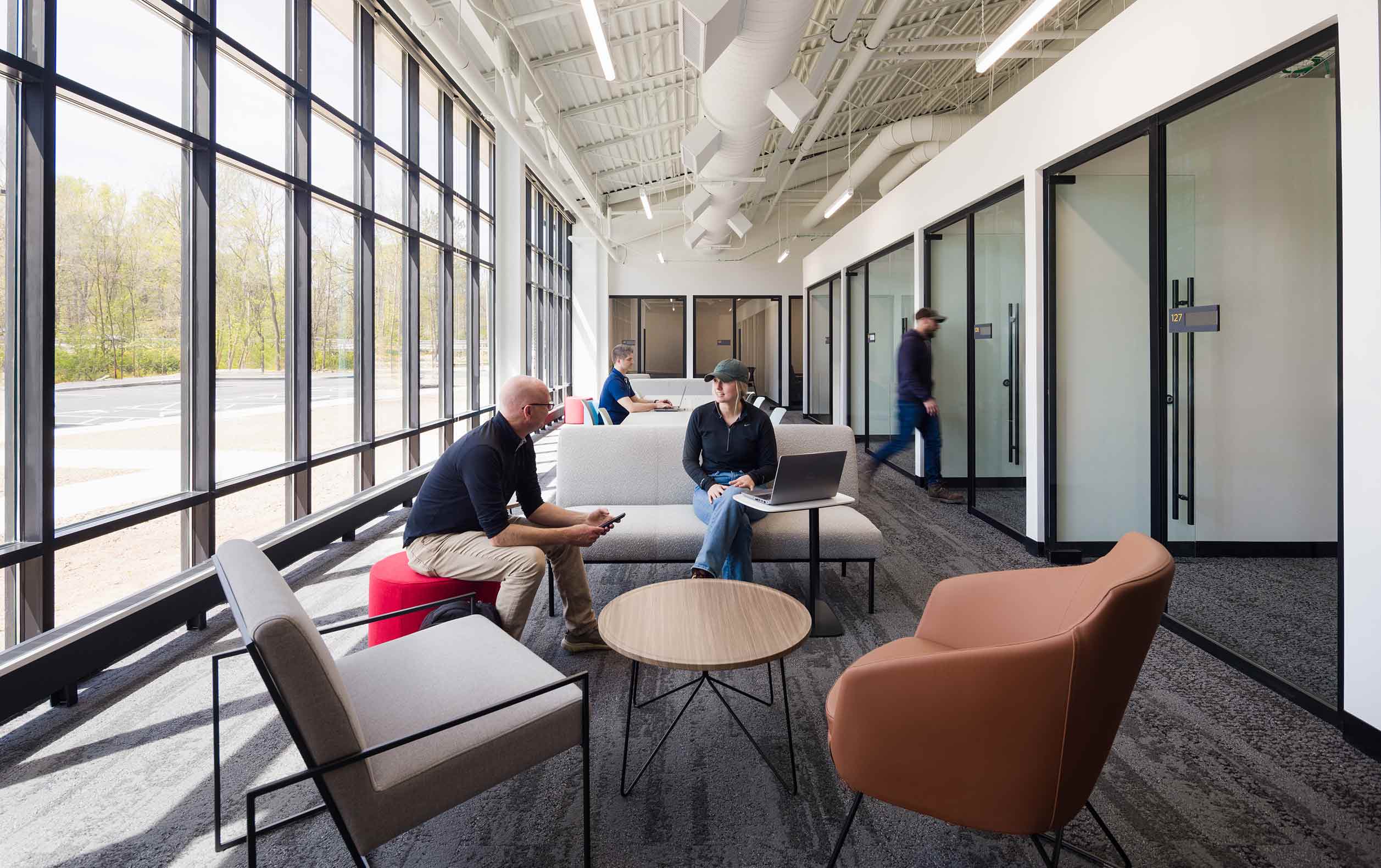 University building corridor meeting area with welcoming furniture