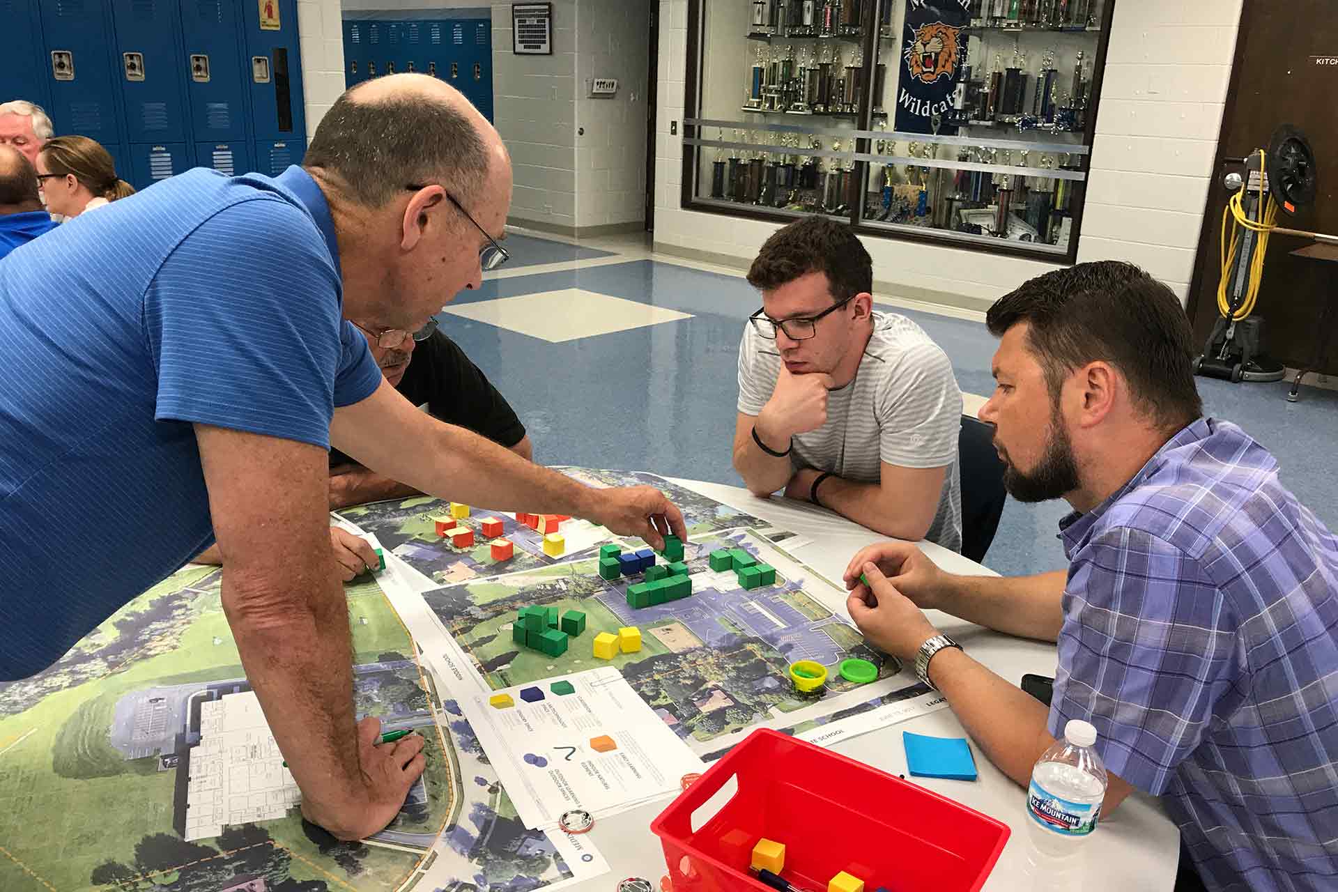 school district representatives working on floor plan at community meeting