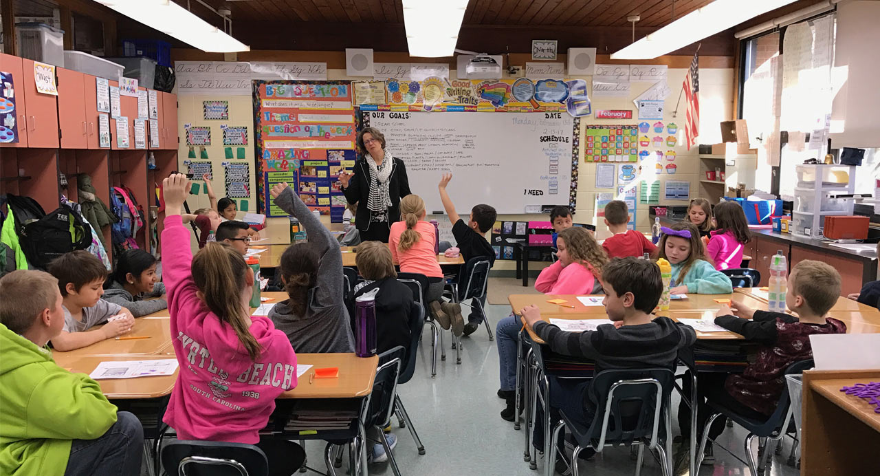 Architect speaking to a classroom of young students