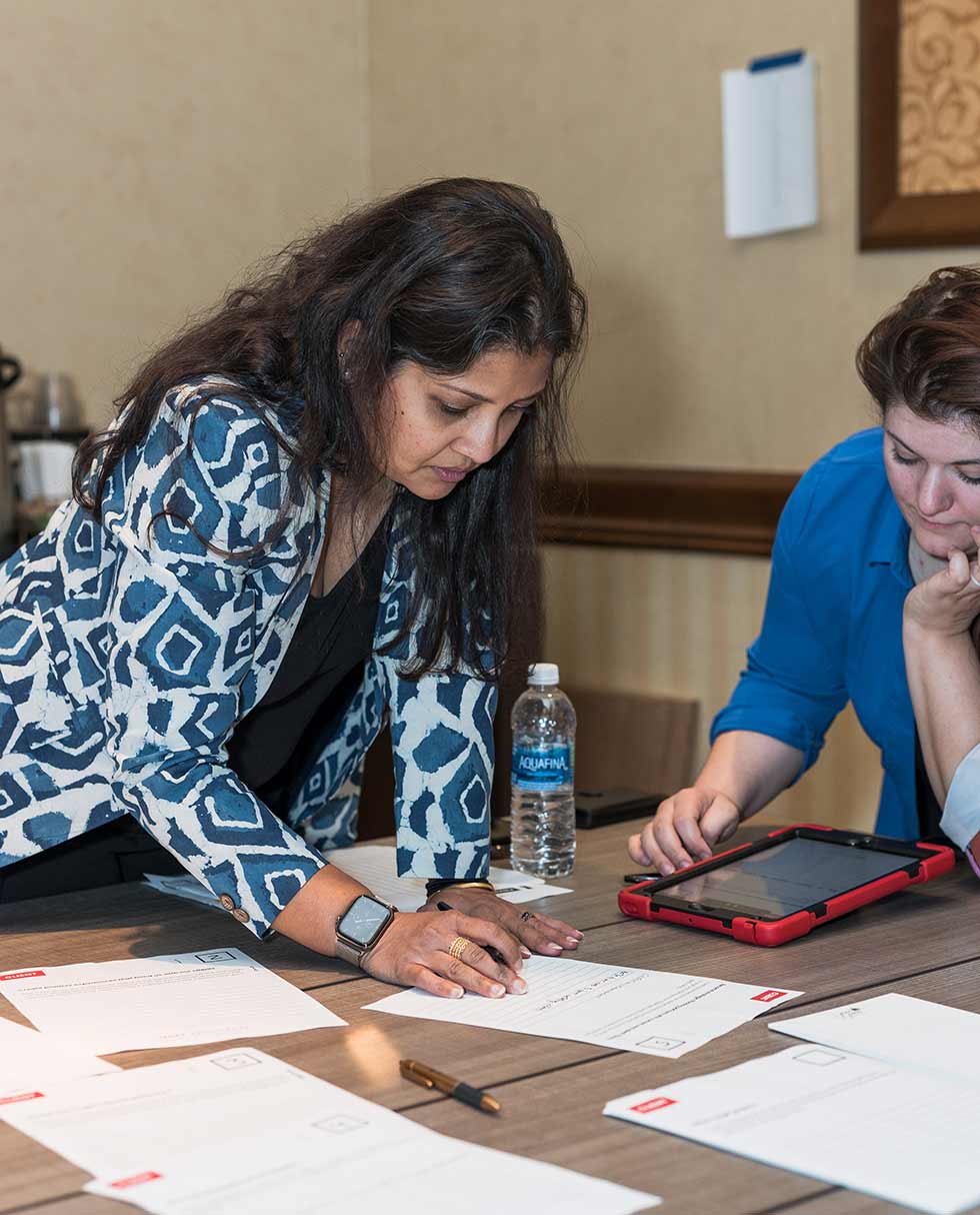 Female architects standing and working on a project